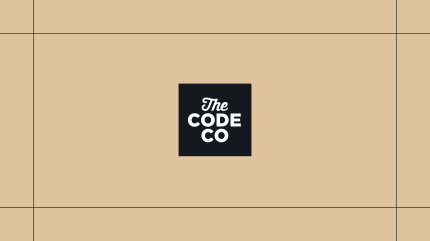 Black The Code Company logo on a gold background, framed by thin black lines.