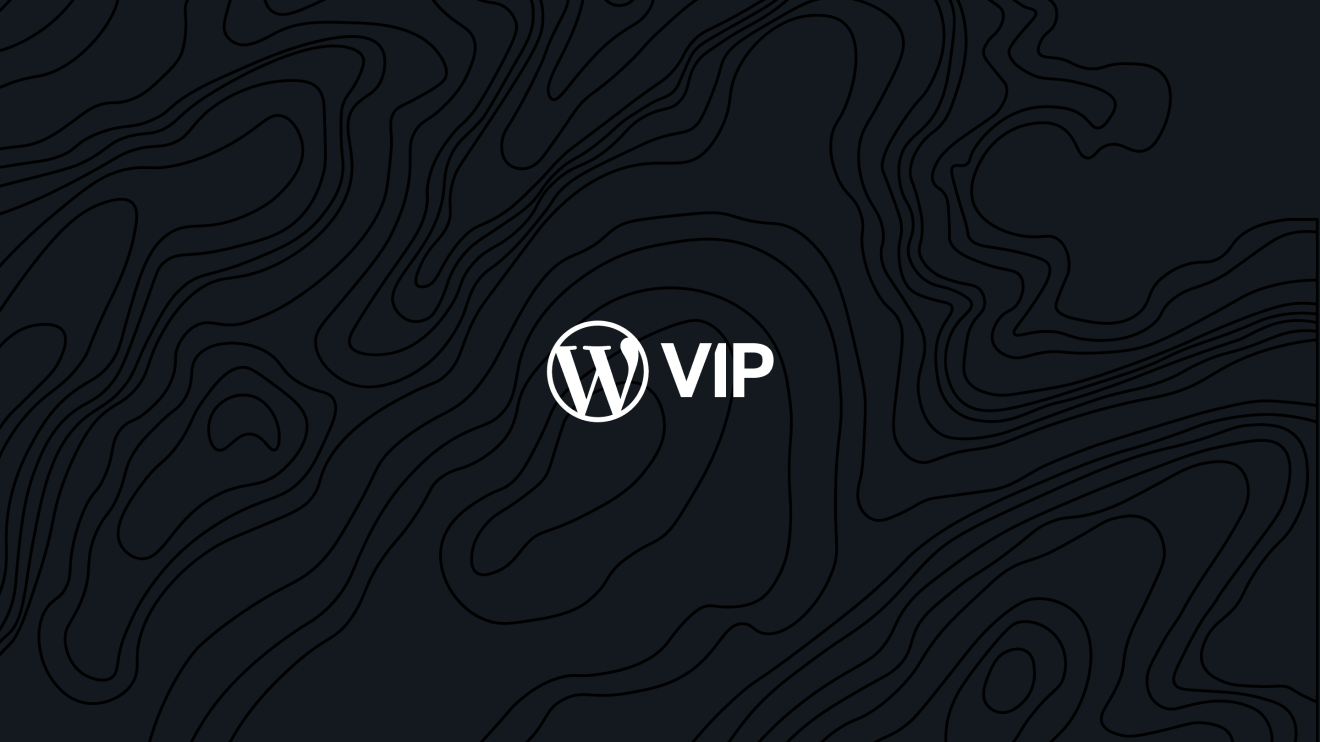 white WordPress VIP logo on black blackground