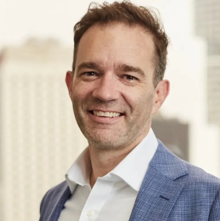 Headshot of Adam Thomas, CTO, OFX