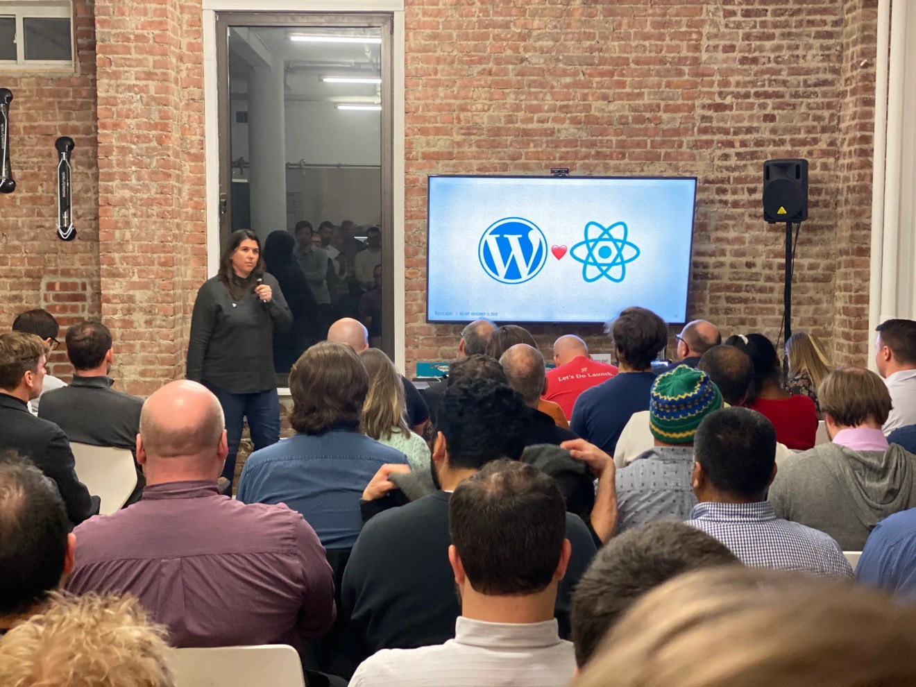 Gina Trapani on stage at Big WP discussing the powerful relationship between WordPress and React