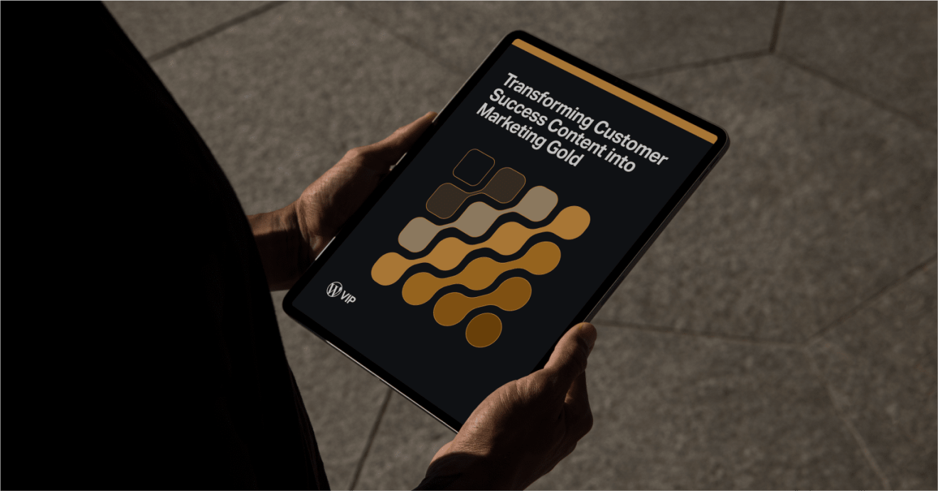Person holding a tablet showing marketing ebook content for digital solution publishing workflows.