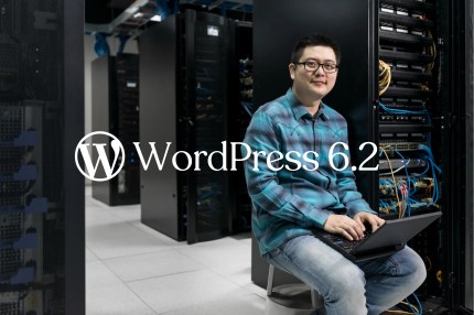 Man sitting in front of servers with a laptop in his hand. "WordPress 6.2" title in the centre of the image.