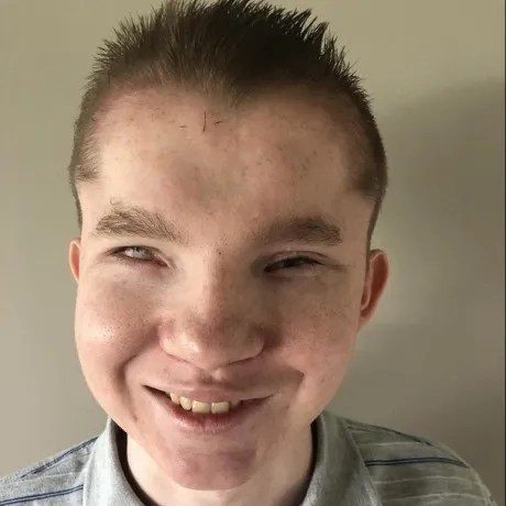 Headshot of Alex Stine, DevOps Engineer & Accessibility Consultant