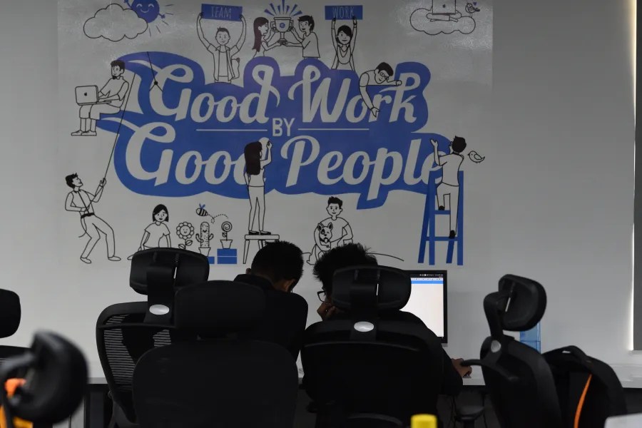 rtCamp's Good Work by Good People slogan on a office wall
