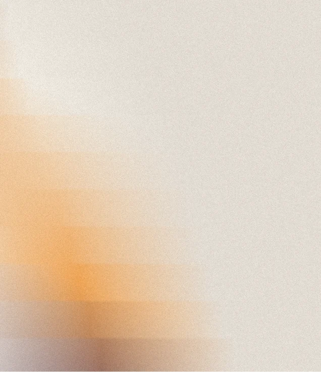 Blurry abstract gradient with soft orange and beige tones blending smoothly from left to right.