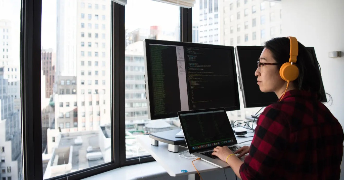 woman working on how to improve wp query performance on her WordPress website