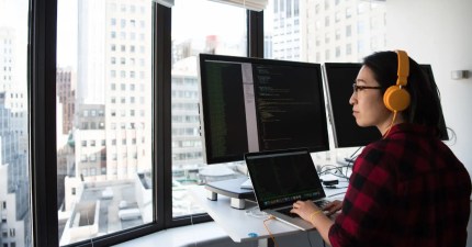 woman working on how to improve wp query performance on her WordPress website
