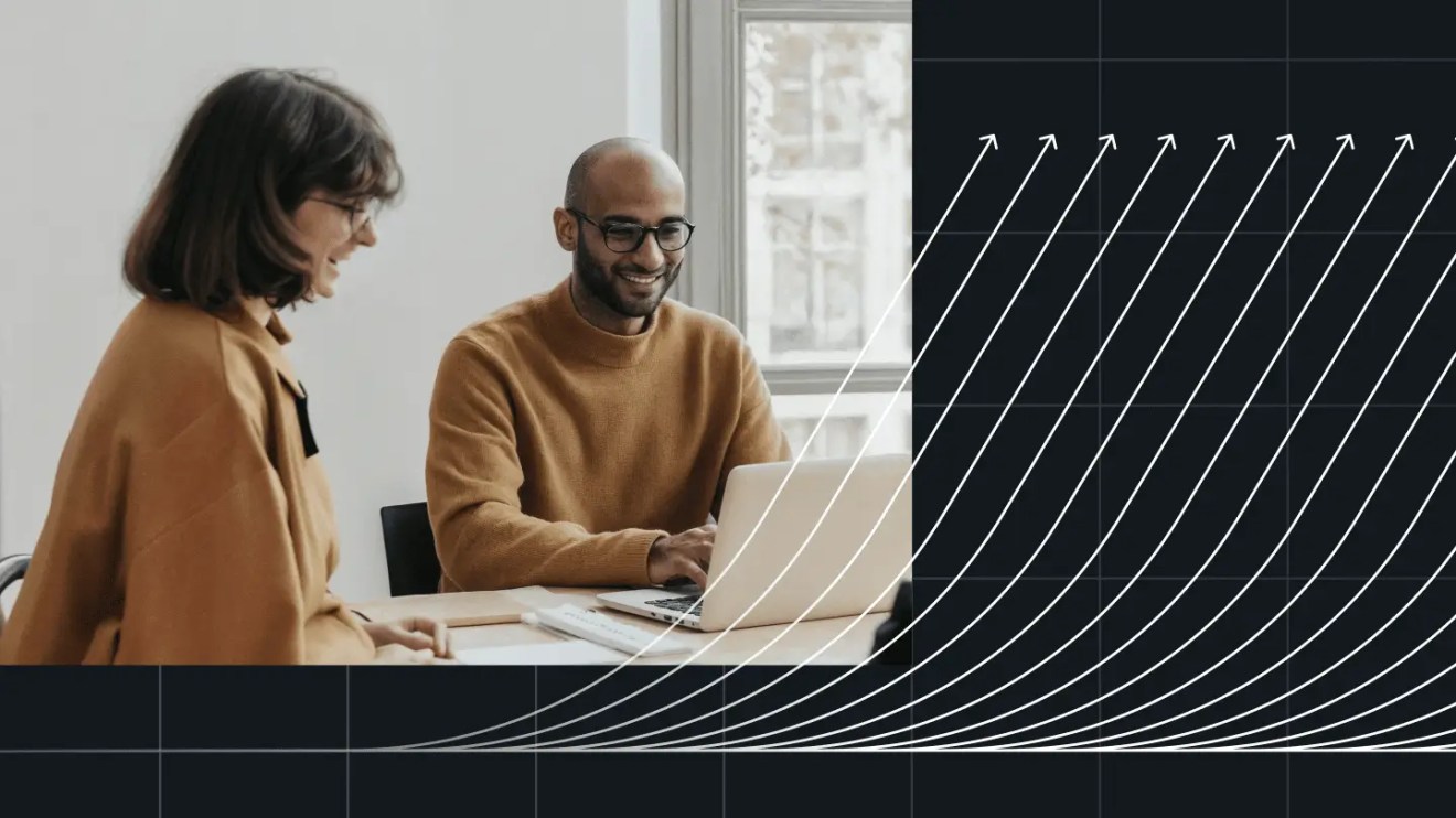 Two nonprofit team members collaborating at a laptop with upward growth graphics overlay, representing scalability and impact with WordPress VIP for Non Profits.