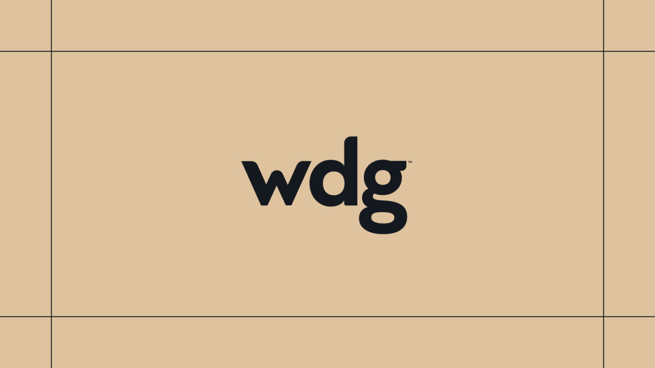WDG logo on a gold background, framed by thin black lines.